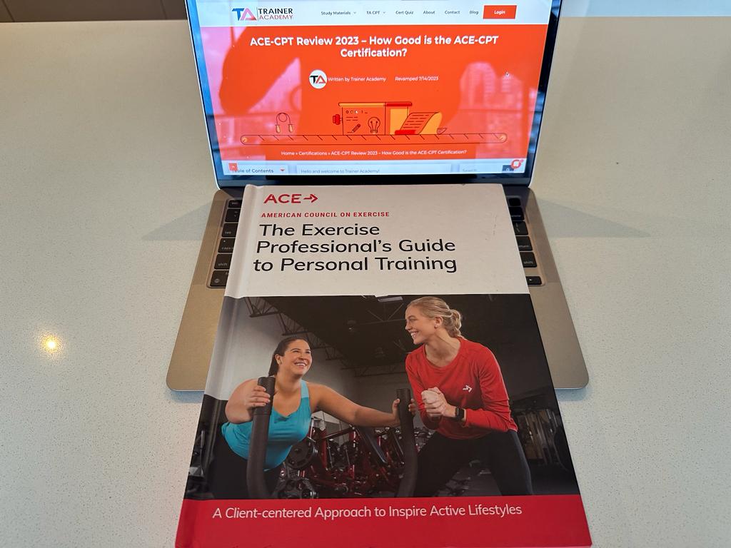 here is an image of the ace cpt review textbook with laptop