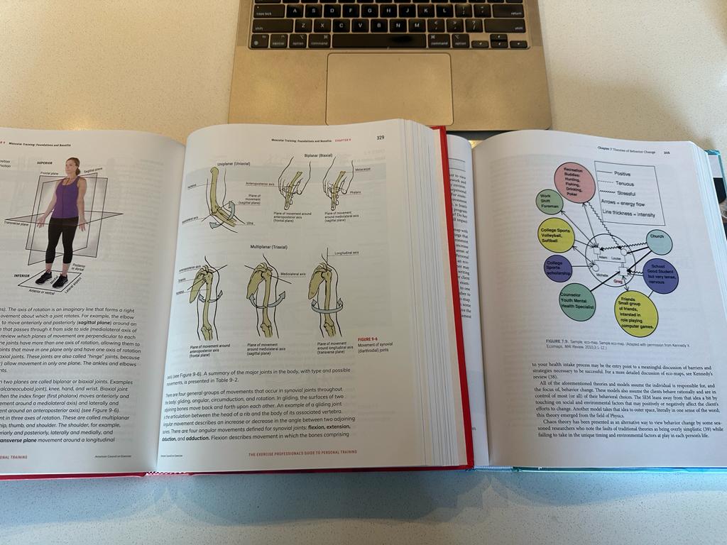 Both the ACE and ACSM personal training textbooks open to a page to compare