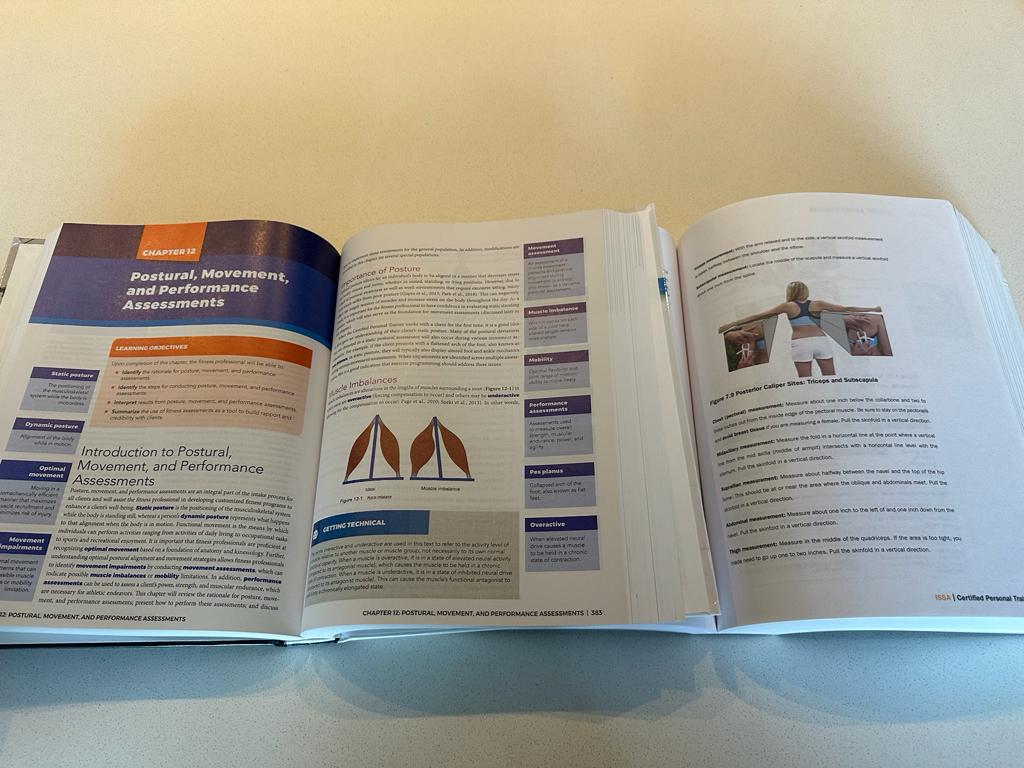 Open textbooks for the ISSA and NASM showing some diagrams and charts in the book