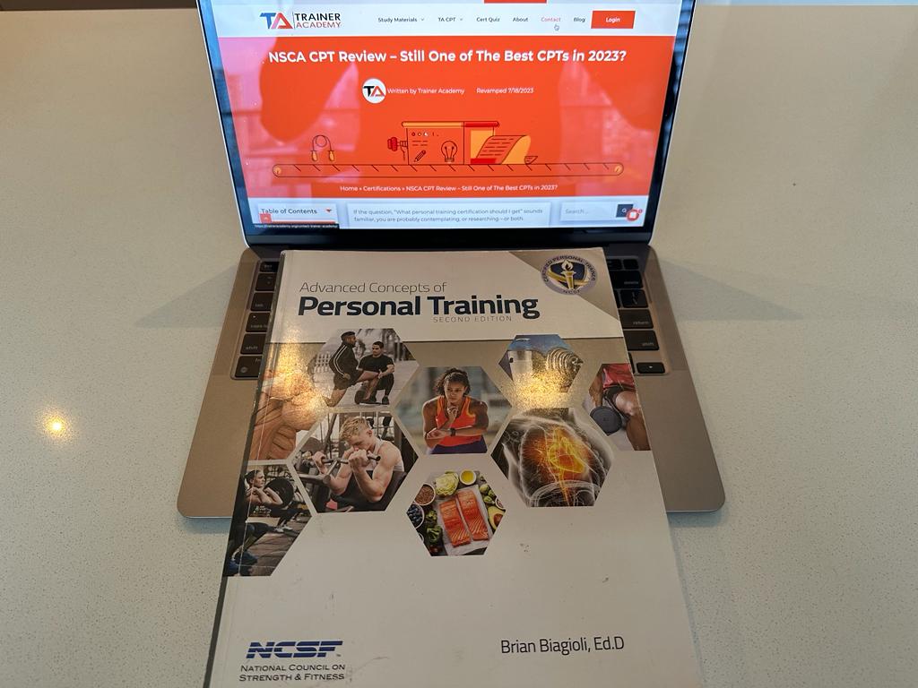 The NSCF textbook sitting on a laptop showing the NSCA CPT review from TA